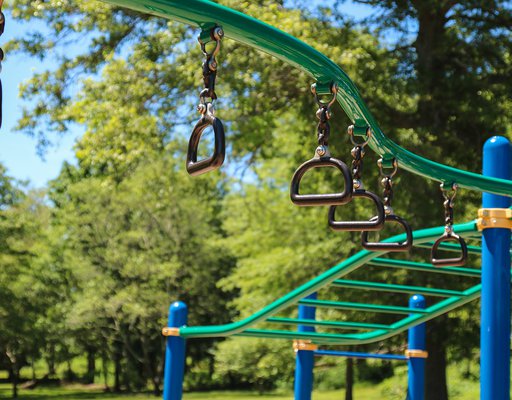 monkey bars and rings at the jungle gym playground.